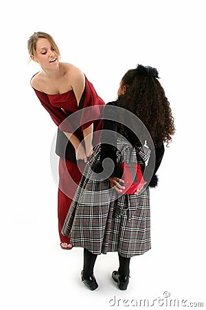 Girls in Formal Dresses with Gift Stock Photo