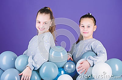 Girls friends near air balloons. Start party. Birthday party. International childrens day. Carefree childhood. Sisters Stock Photo