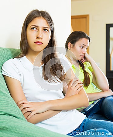 Girls friends sitting and discontent Stock Photo