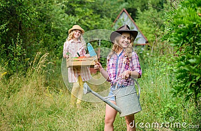 Girls with gardening tools. Child friendly garden tools ensure safety of child gardener. Cute gardener concept. Loving Stock Photo