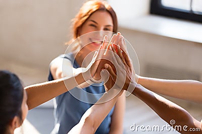 Girls giving high five, close up focus on hands Stock Photo