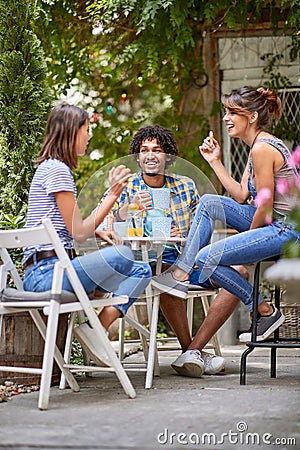 Girls with guy drinking and having fun Stock Photo