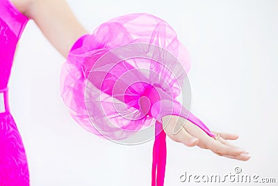 Girls hand dressed in a pink glove with a round flashlight Stock Photo
