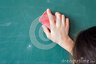 Girls hand in elementary school cleaning board with sponge Stock Photo