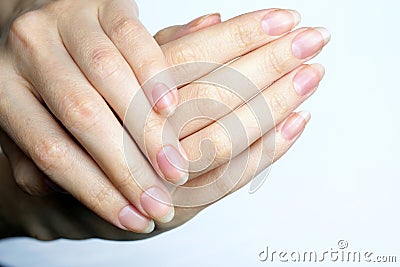 Natural female hands on a white background top view. Stock Photo