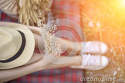 Girls legs lying in grass barefoot without shoes Stock Photo