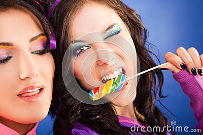 Girls lollipop blink Stock Photo