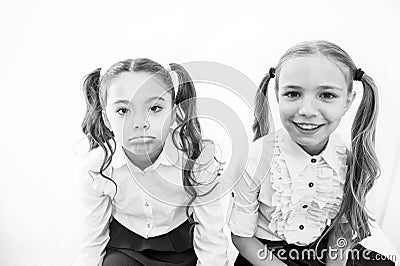 Girls long hair ponytails white background. Schoolgirls cute friends. Hair care and treatment. Long hair treatment. How Stock Photo