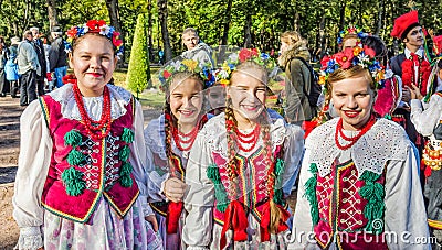 The girls members of the Polish folk dance GAIK walking in the park. Editorial Stock Photo