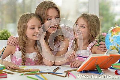 Girls with mother on lesson of art Stock Photo