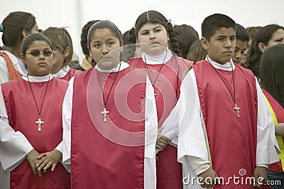 Girls observing intently on Good Friday Editorial Stock Photo