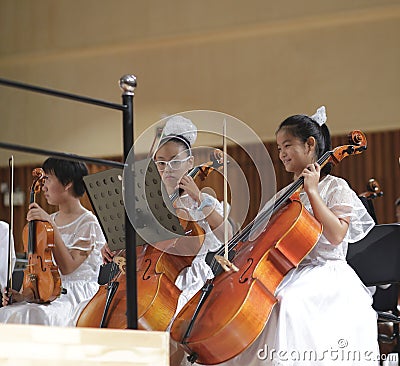 Girls play cello Editorial Stock Photo