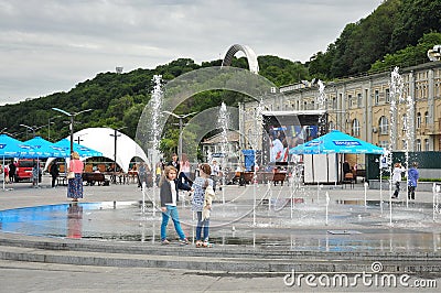 Girls playing at the fountain, football fanzone Editorial Stock Photo