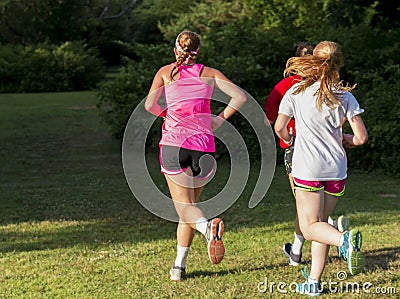 Girls running in bright sunlight Editorial Stock Photo