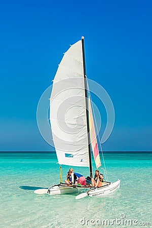 Girls sailing on a colorful catamaran at Varadero beach in Cuba Editorial Stock Photo
