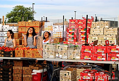 Girls Selling Produce at Farmers Market Editorial Stock Photo