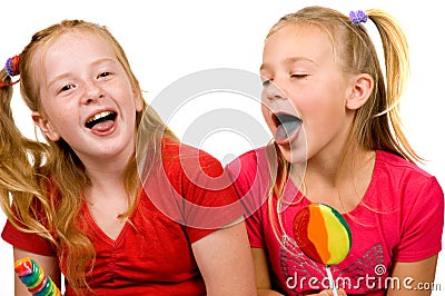 Girls are showing their blue tongue Stock Photo