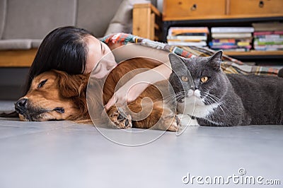 Girls sleep with cats and dogs Stock Photo