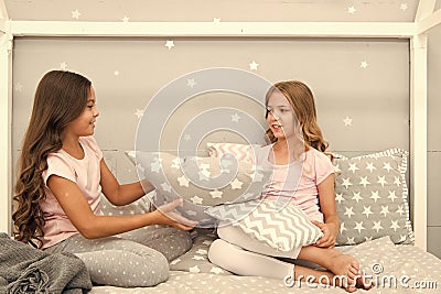 Girls sleepover party ideas. Soulmates girls having fun sleepover party. Girls happy friends with cute pillows. Pillow Stock Photo