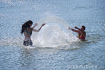 girls squirting water Editorial Stock Photo