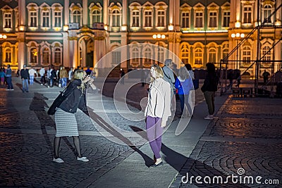 Girls are taking pictures near the Winter Palace Editorial Stock Photo