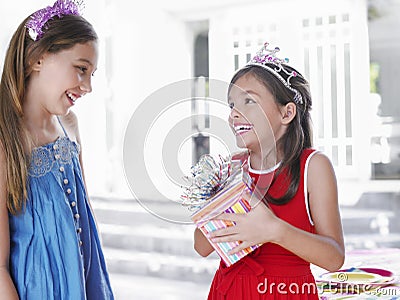 Girls In Tiaras With Present Stock Photo