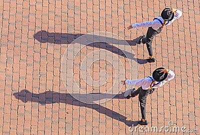 Girls walking in parade in costume Stock Photo