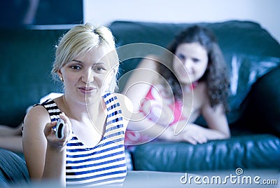 Girls watching tv Stock Photo