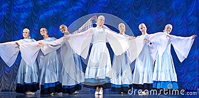 Girls in white dresses dancing on stage, Russian National Dance Editorial Stock Photo