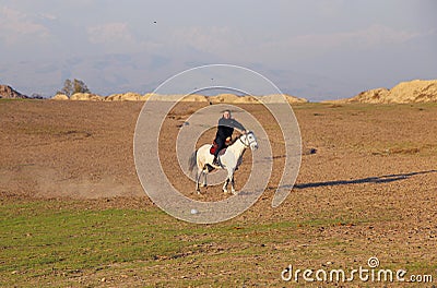 Gisfor, Tajikistan - November 12 2022: Man rides a horse Editorial Stock Photo