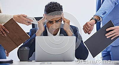 Give me a break for once. Shot of a young businessman looking stressed out in a demanding office environment. Stock Photo