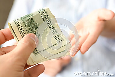 Give money to someone as bribe to suggest a corrupt system Stock Photo