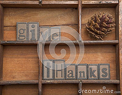 Give Thanks with pine cone - concept. Stock Photo