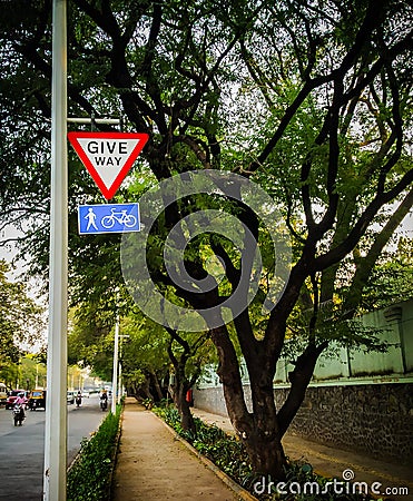 give way for pedestrians and cycle sign board Stock Photo