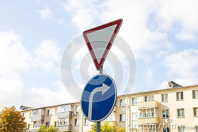 Give way road sign on blue sky background Stock Photo