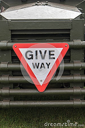 Give Way warning road traffic sugn symbol on the front of a vintage military vehicle truck Editorial Stock Photo