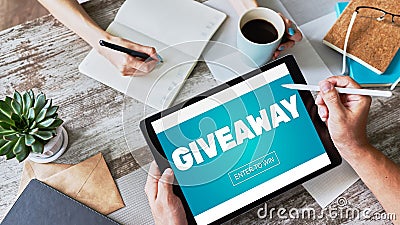 Giveaway, enter to win text on screen. Lottery and prizes. Social media marketing and advertising concept. Stock Photo