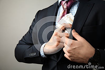 Giving bribe to official, man in suit is corrupt Stock Photo