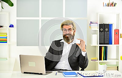 Giving business advice. confident brutal businessman. Elegant businessman analyzing data in smartphone. Quarantine agile Stock Photo