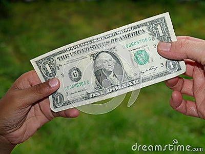 Giving dollar Stock Photo