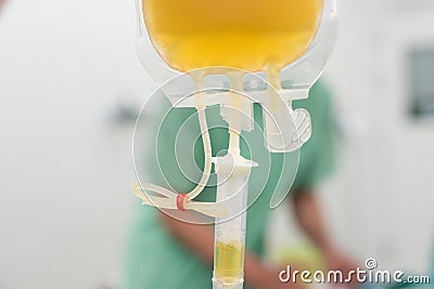 Giving fresh frozen plasma blood components during surgery Stock Photo