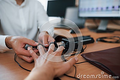Giving the hand. Preparation for the polygraph test. Conception of the lie detector Stock Photo