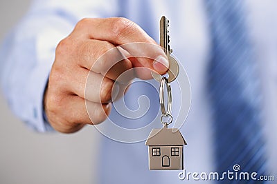 Giving house keys Stock Photo