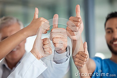 Giving life the thumbs up. medical staff giving the thumbs up. Stock Photo