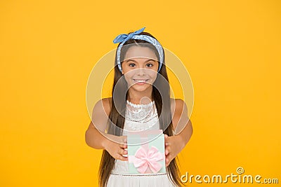 Giving is the most pleasure. Happy girl enjoy gift giving. Small child give present. Giving and receiving. Holiday Stock Photo