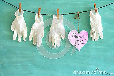 Giving respect to the people working in the health care system, thank you, medical gloves and a heart symbol,covid-19, corona Stock Photo