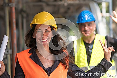 Giving the V-sign on construction site Stock Photo