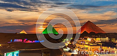 The Giza buildings near the Great Egypt Pyramids, enlighted at night Editorial Stock Photo