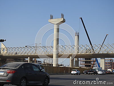 Giza Egyptian overhead transportation system monorail construction site with concrete and steel columns and cranes Editorial Stock Photo