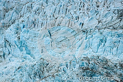 Glacial blues and dirt browns in fractured ice patterns on glacier in Drygalski Fjord, South Georgia, as a nature background Stock Photo